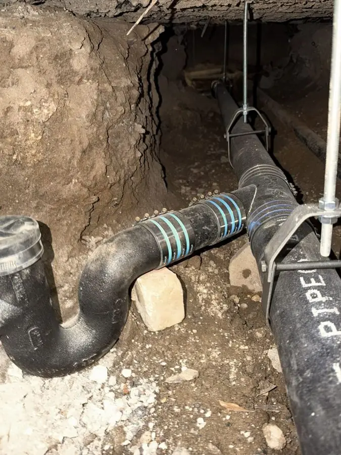New no-hub cast iron wye and trap tied into a replaced main drain